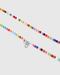 Silver-tone lobster clasp and engraved STICKYZOO charm disc on a handmade beaded cross-body phone strap.