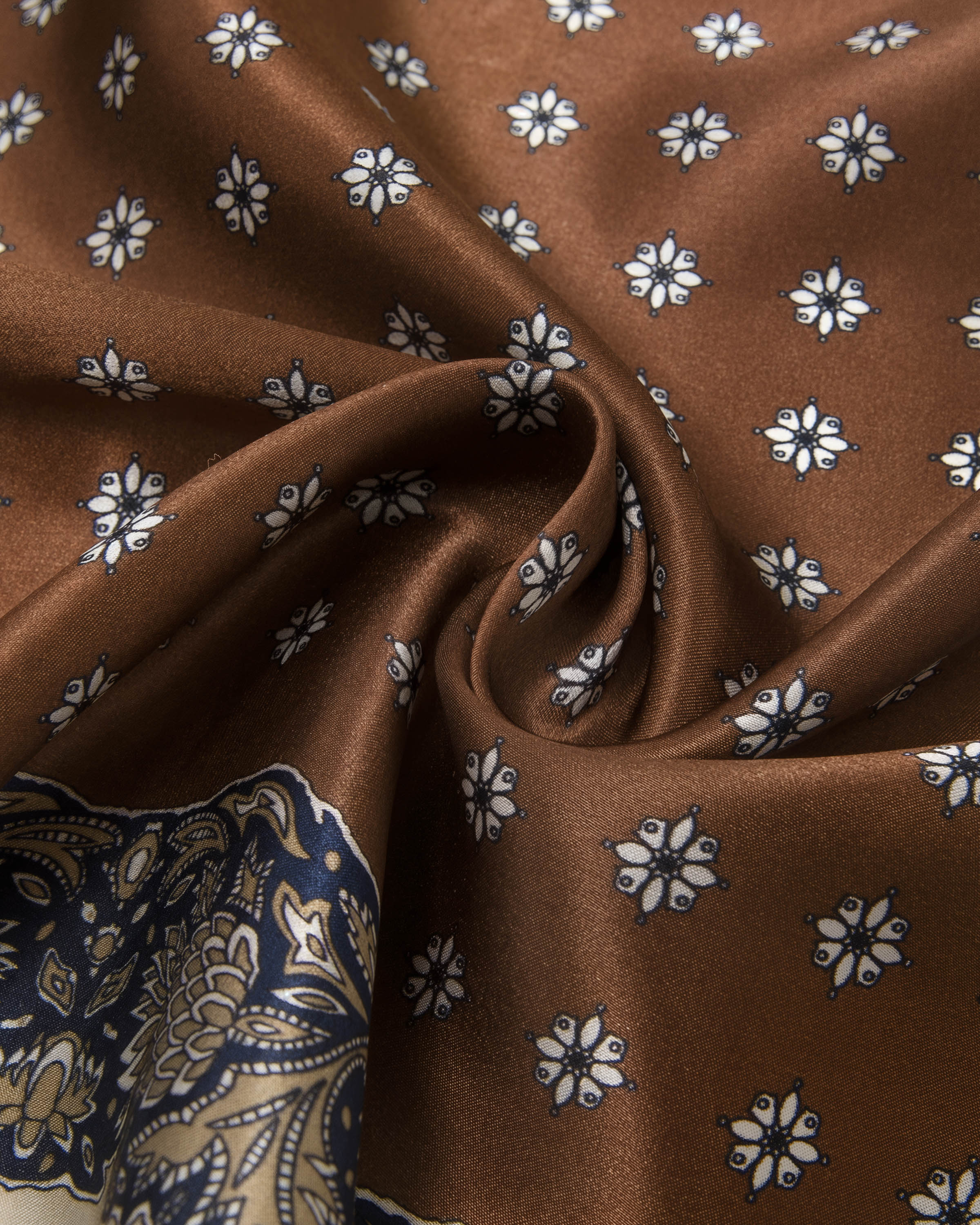 STICKYZOO chestnut silk scarf draped to show the small white floret tile printed on the warm silk field
```