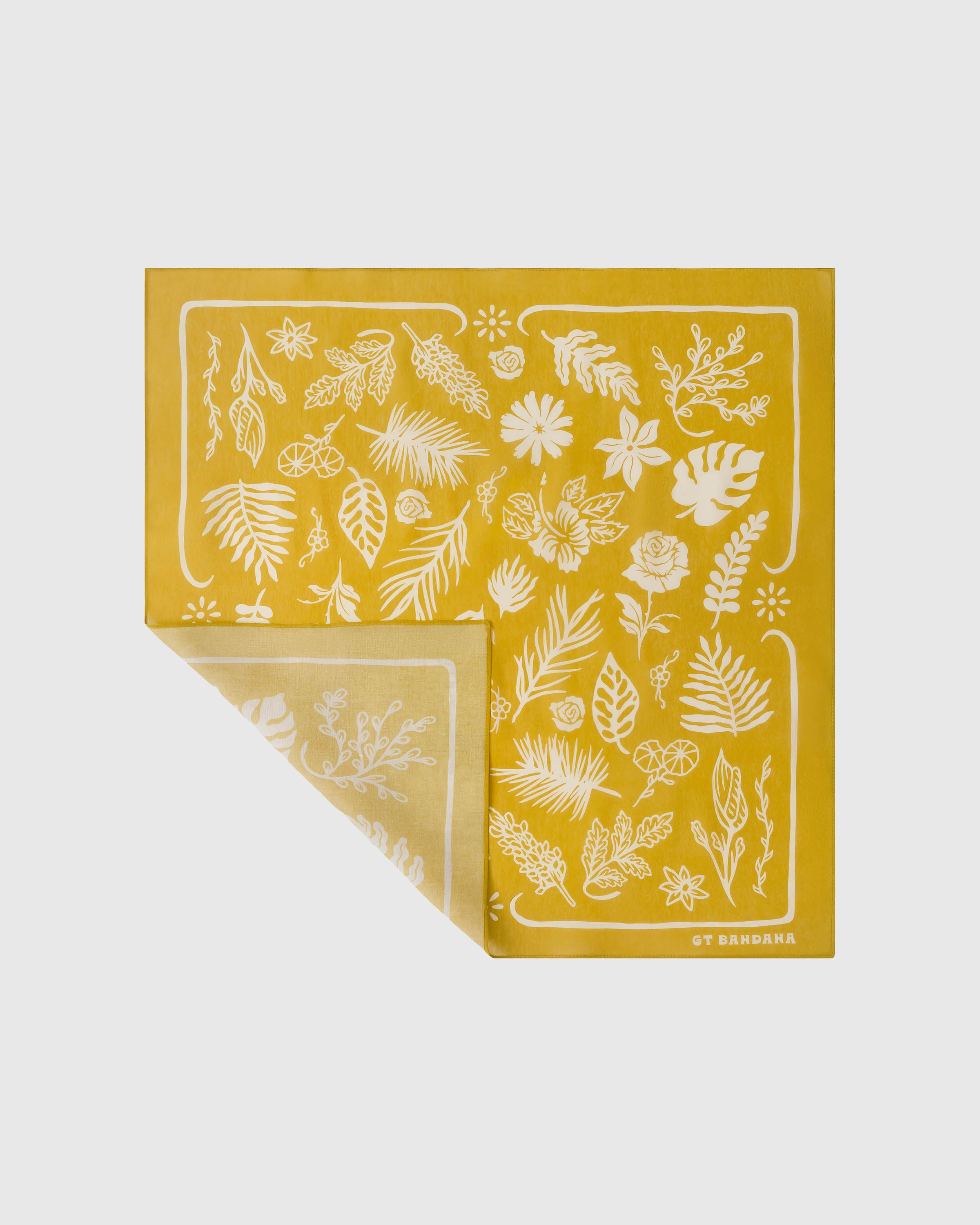 Silk herbarium scarf folded to show the mustard field with scattered ivory botanical print