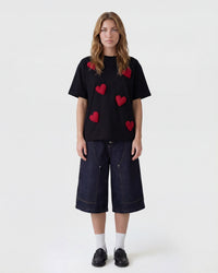 Back view of STICKYZOO Scattered Heart T-Shirt in black showing clean silhouette and dropped shoulders