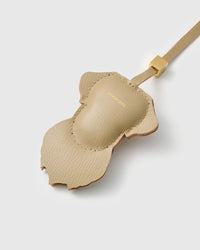 Back view of the Labrador Retriever charm — smooth sand French Alran goatskin with gold STICKYZOO embossing. Clean finish.