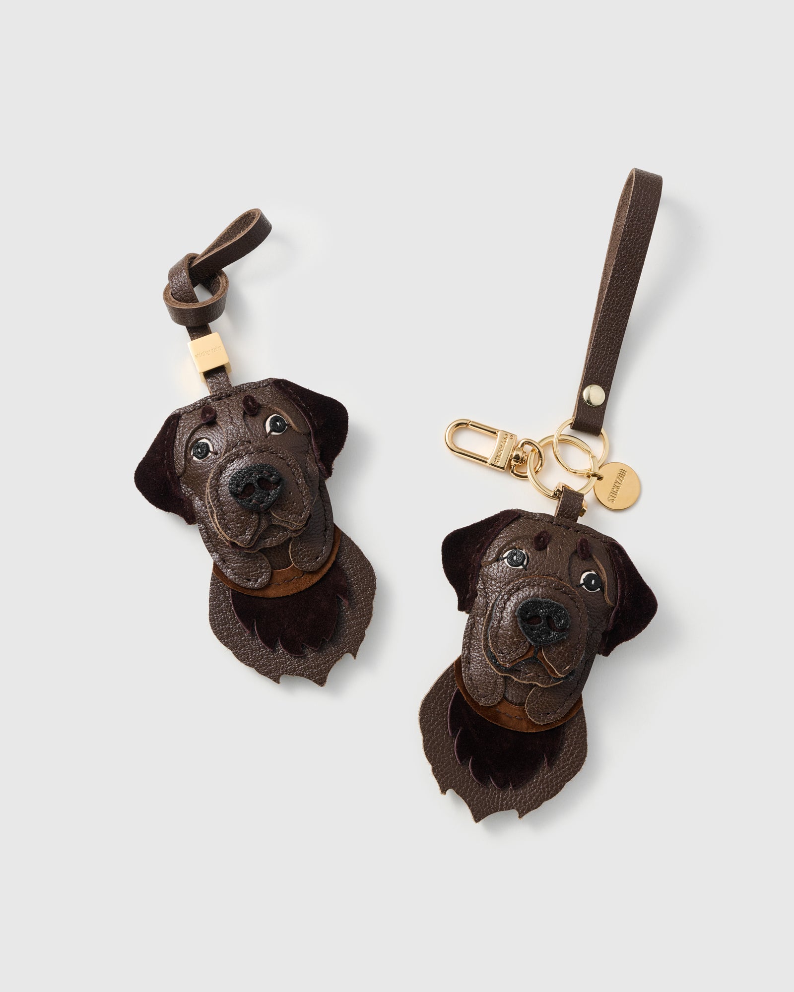 {{"People stop me to ask about it." — Mia K.}} Labrador Retriever charm on a bag, side angle — French Alran goatskin + suede, 3 days by hand.