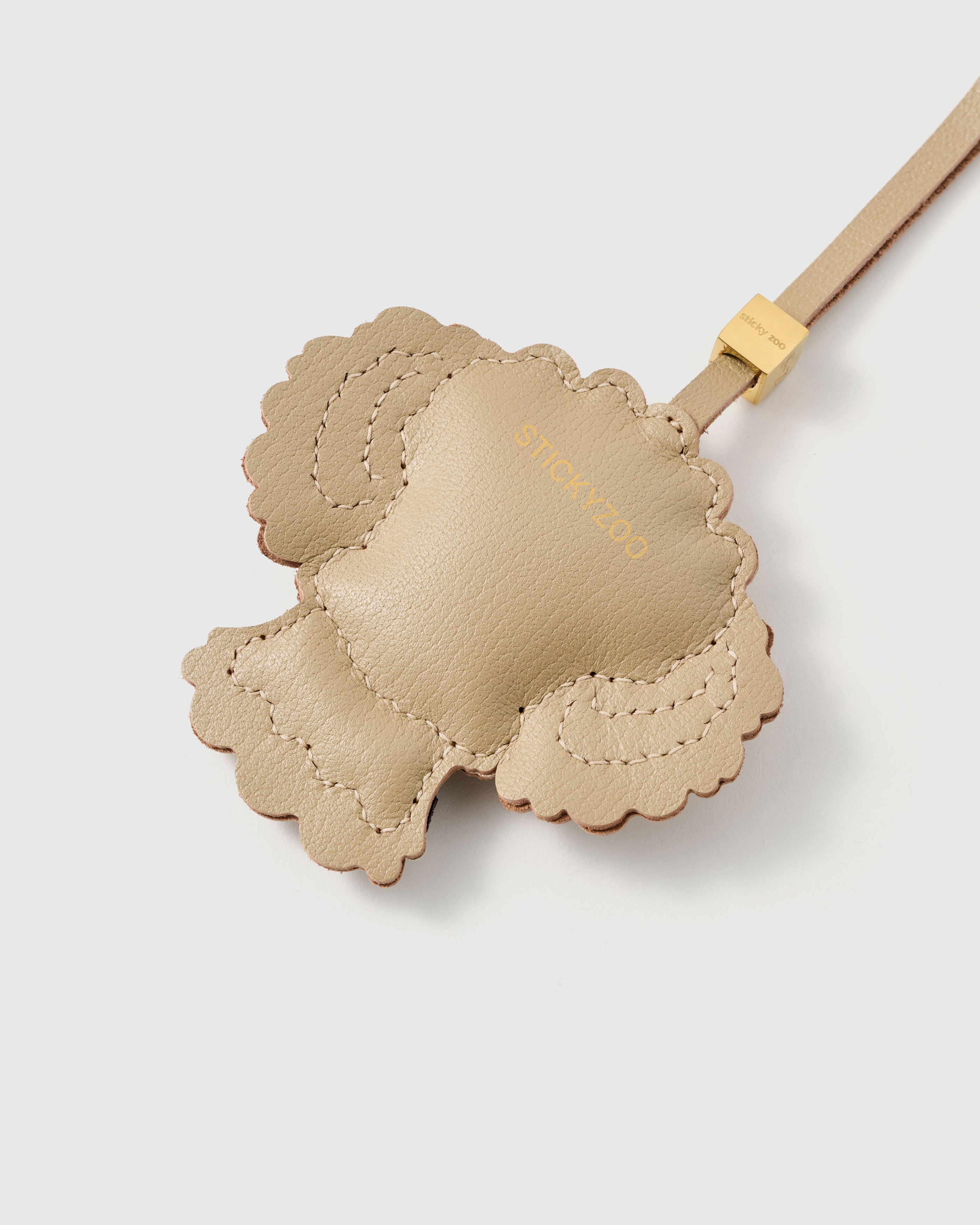 {{Finished on both sides.}} smooth French Alran goatskin with gold STICKYZOO embossing. Scalloped edge stitching. 72 hours of handcraft.