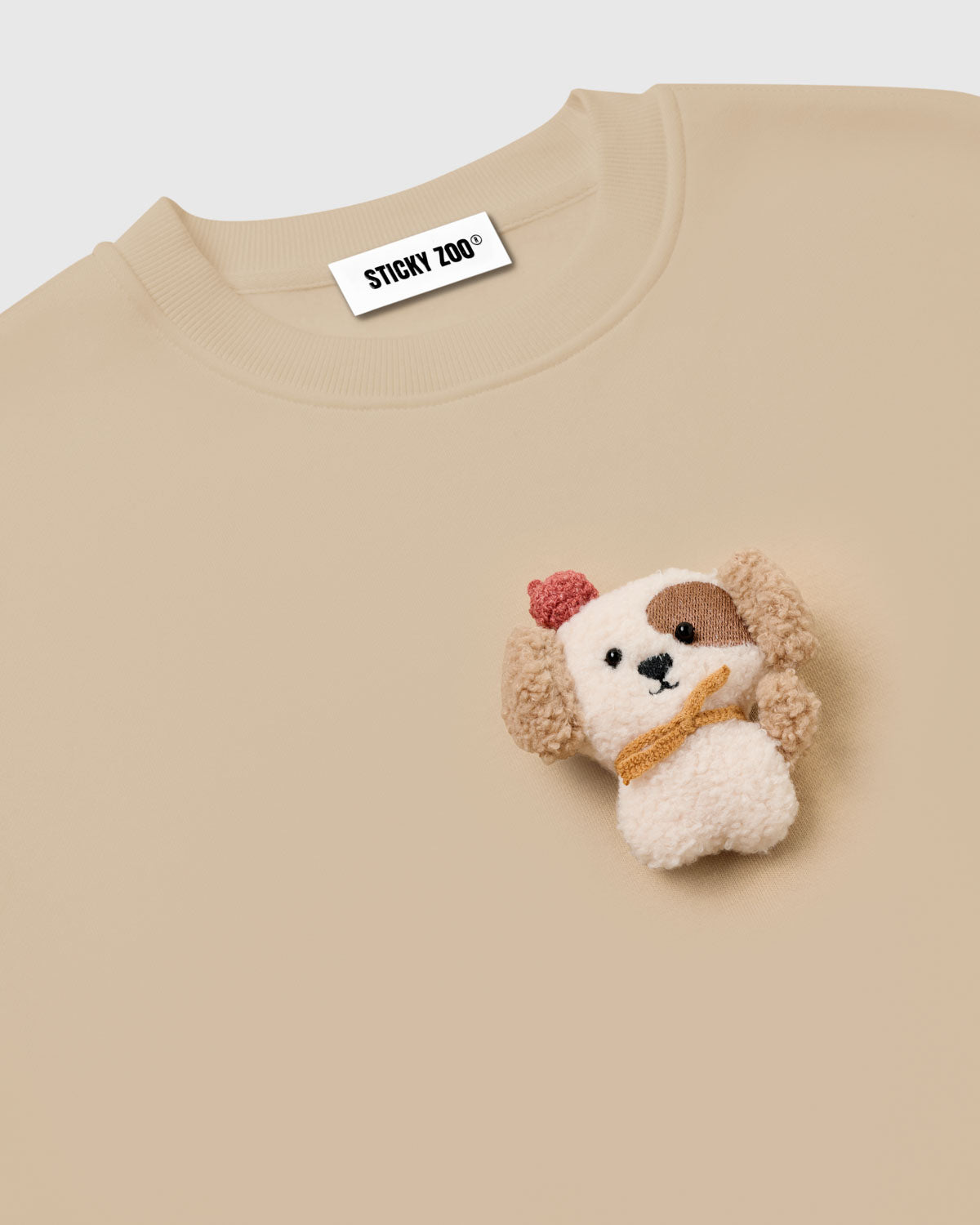 {{Rated 4.9 by thousands}} Macro close-up of hand-stitched plush puppy showing dimensional sherpa texture, brown eye patch, and embroidered nose