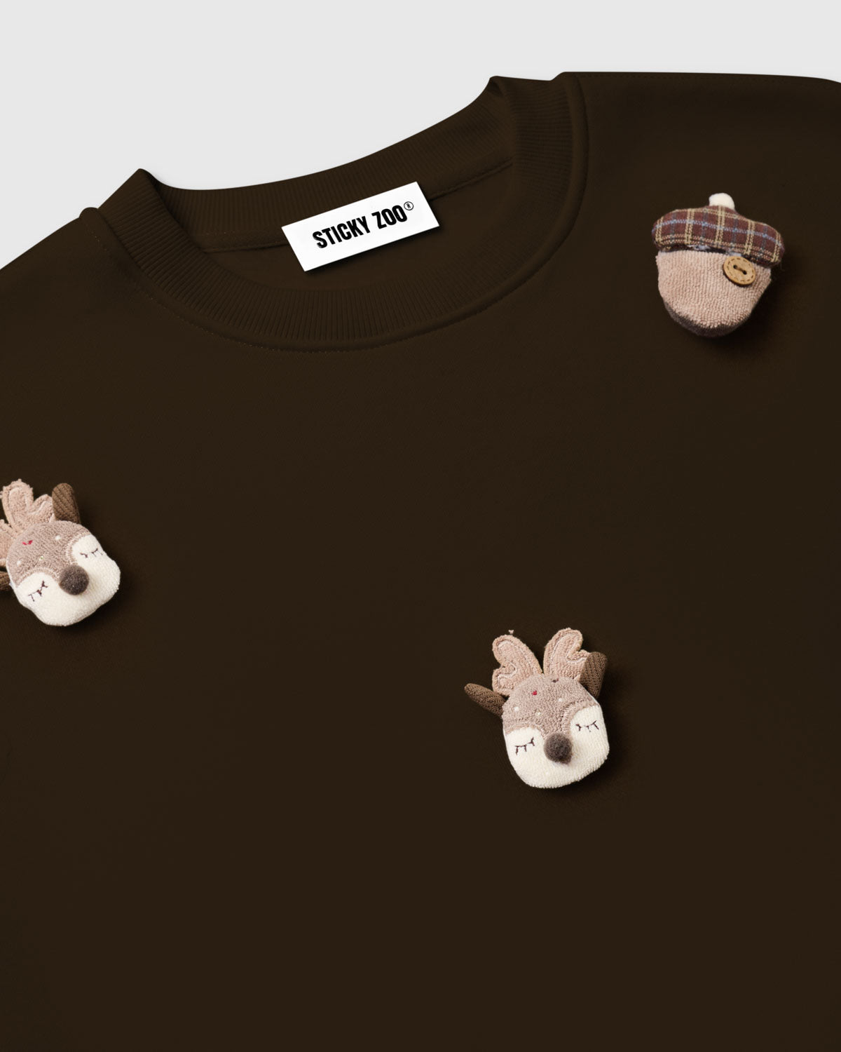 {{Kept by 99% of buyers}} Back view of STICKYZOO Reindeer and Acorn Sweatshirt in brown showing dropped shoulders