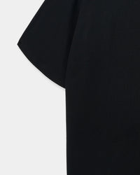 Close-up of shoulder and sleeve on black Hug-Me Bear T-Shirt showing fabric weight