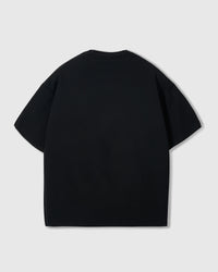 Full styling of black Shrimp Hug T-Shirt showing relaxed boxy proportions