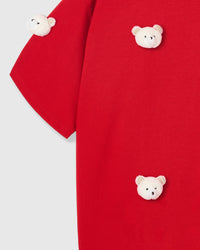 Multiple plush bear appliques on STICKYZOO red tee showing scatter pattern