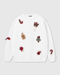 STICKYZOO Teddy Holiday Sweatshirt in white with nine hand-stitched 3D plush holiday character appliques