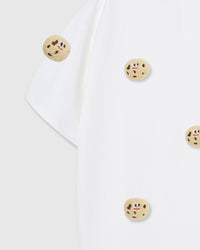 Detail of sleeve and body on STICKYZOO white Cookie T-Shirt showing plush cookies at different angles