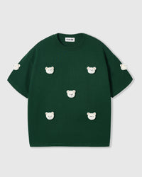 Detail lifestyle shot of check-ear bears on blue cotton