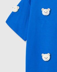 Multiple check-ear bear appliques on STICKYZOO blue tee showing dimensional scatter