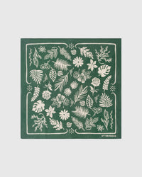 Forest herbarium silk scarf with hand-illustrated ivory botanical silhouettes on a forest-green field by STICKYZOO