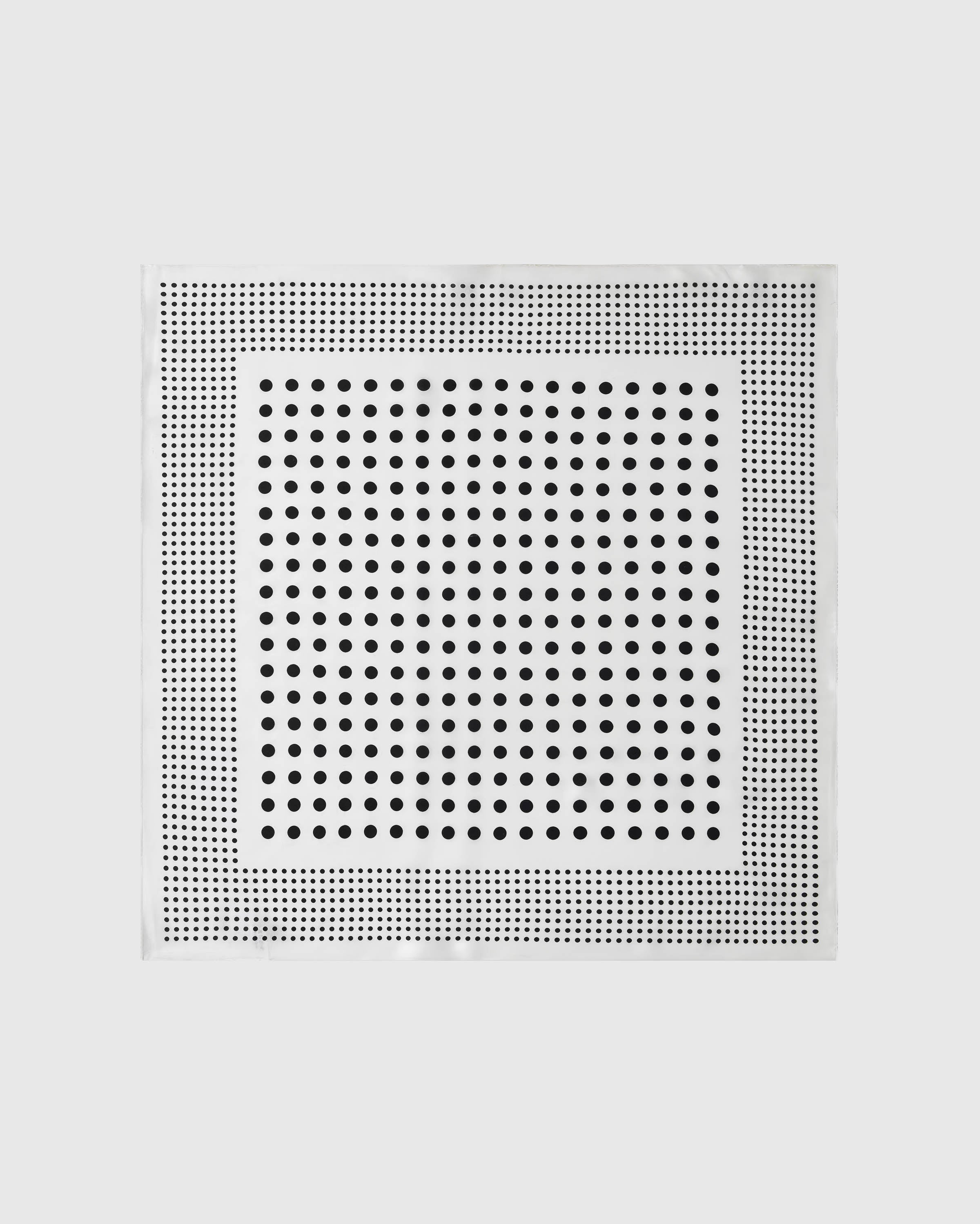 Ivory dot silk scarf with a two-scale black polka dot print on a soft ivory field by STICKYZOO
