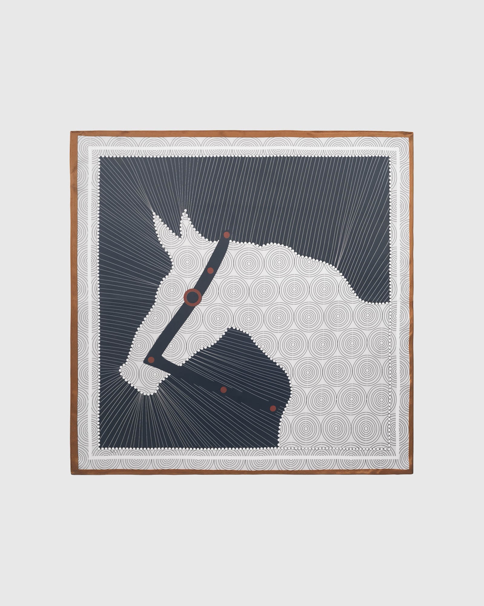 Horse silhouette silk scarf swirled to show the navy field, ivory circles, and cognac edge by STICKYZOO