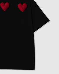 Full styling of black Triple Heart T-Shirt showing relaxed boxy proportions