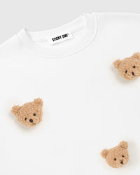 Alternate angle of white Sticky Bear Sweatshirt on model showing relaxed boxy proportions