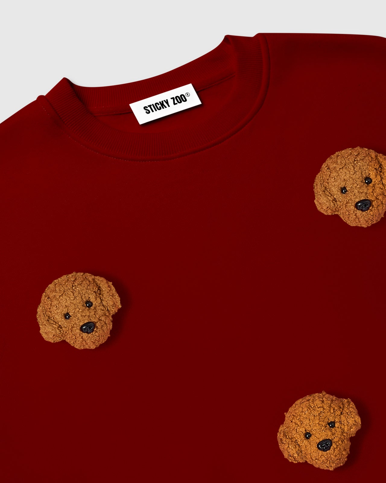 Back view of STICKYZOO Poodle Parade Sweatshirt in burgundy showing oversized silhouette and ribbed hem
