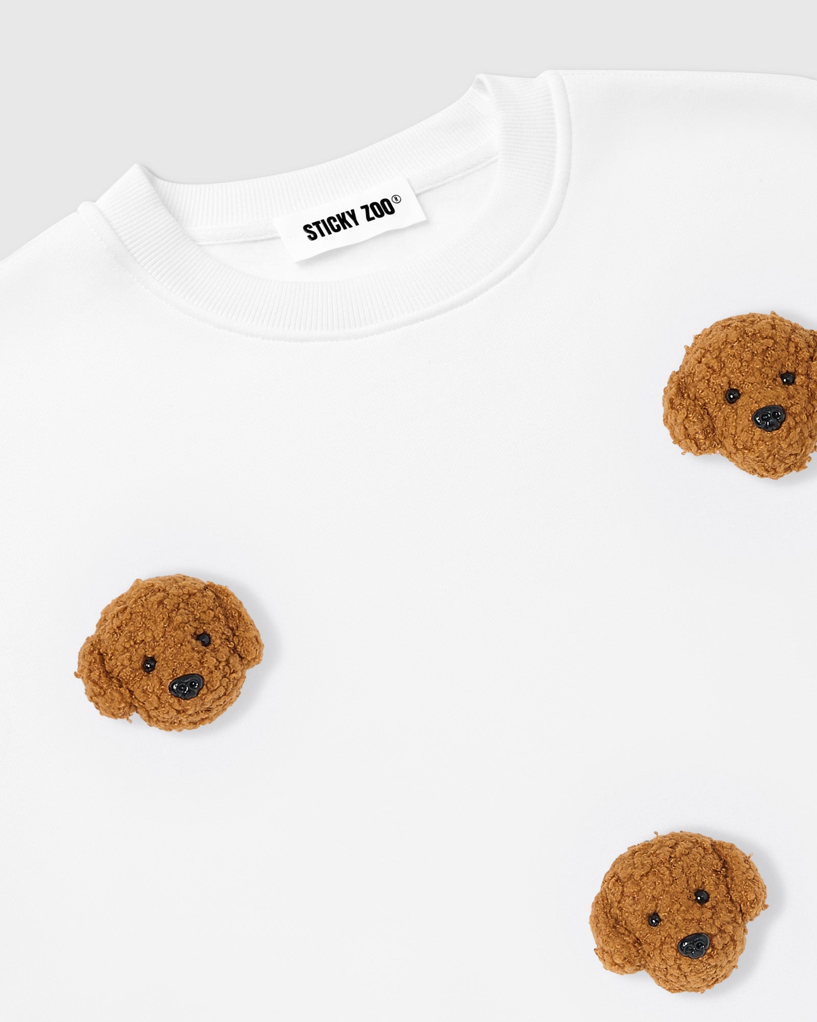 Back view of STICKYZOO Poodle Parade Sweatshirt in white showing clean seams and oversized boxy proportions