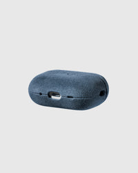 Back view of denim blue Alcantara case showing USB-C port and speaker cutouts