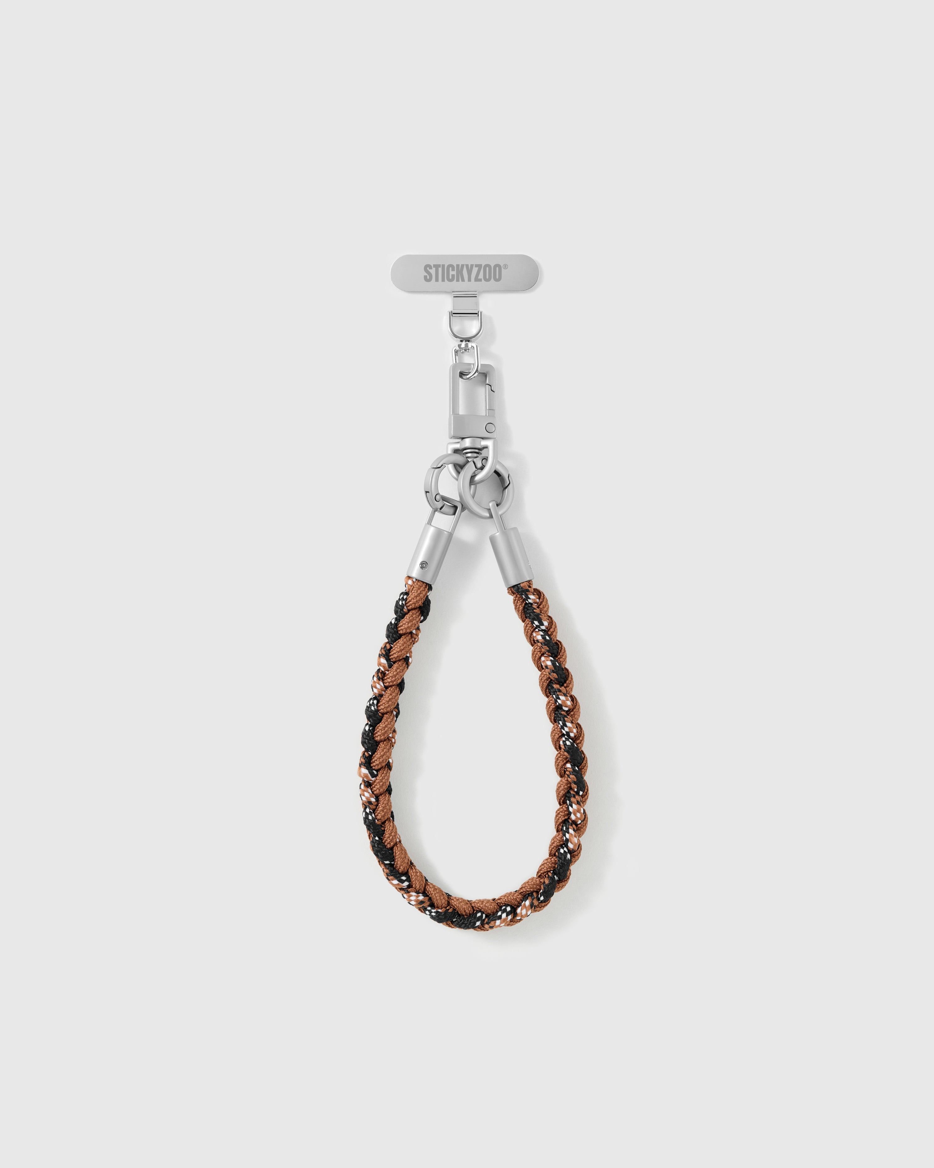 Close-up of the two-tone braided cord loop and silver-tone hardware on the cross-body phone strap