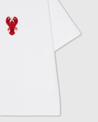 Styled layflat of the white STICKYZOO Lobster T-Shirt showing the beaded lobster applique and the relaxed dropped-shoulder drape.