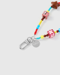 Close-up of silver-tone clasp and engraved STICKYZOO charm disc with colorful mixed beads