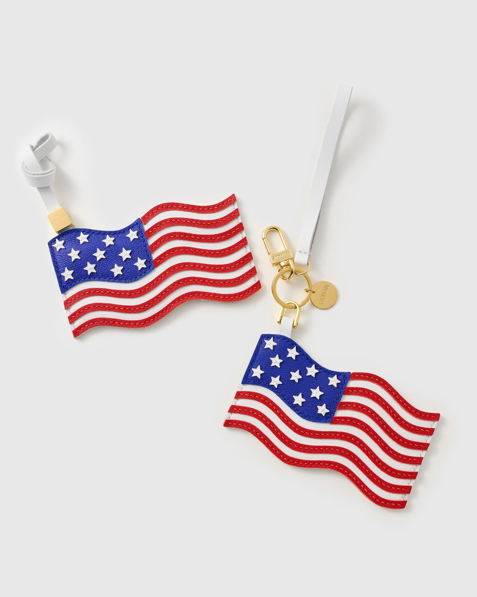 {{18K gold-plated hardware}} USA flag charm with gold keychain clasp, split ring, and engraved STICKYZOO coin