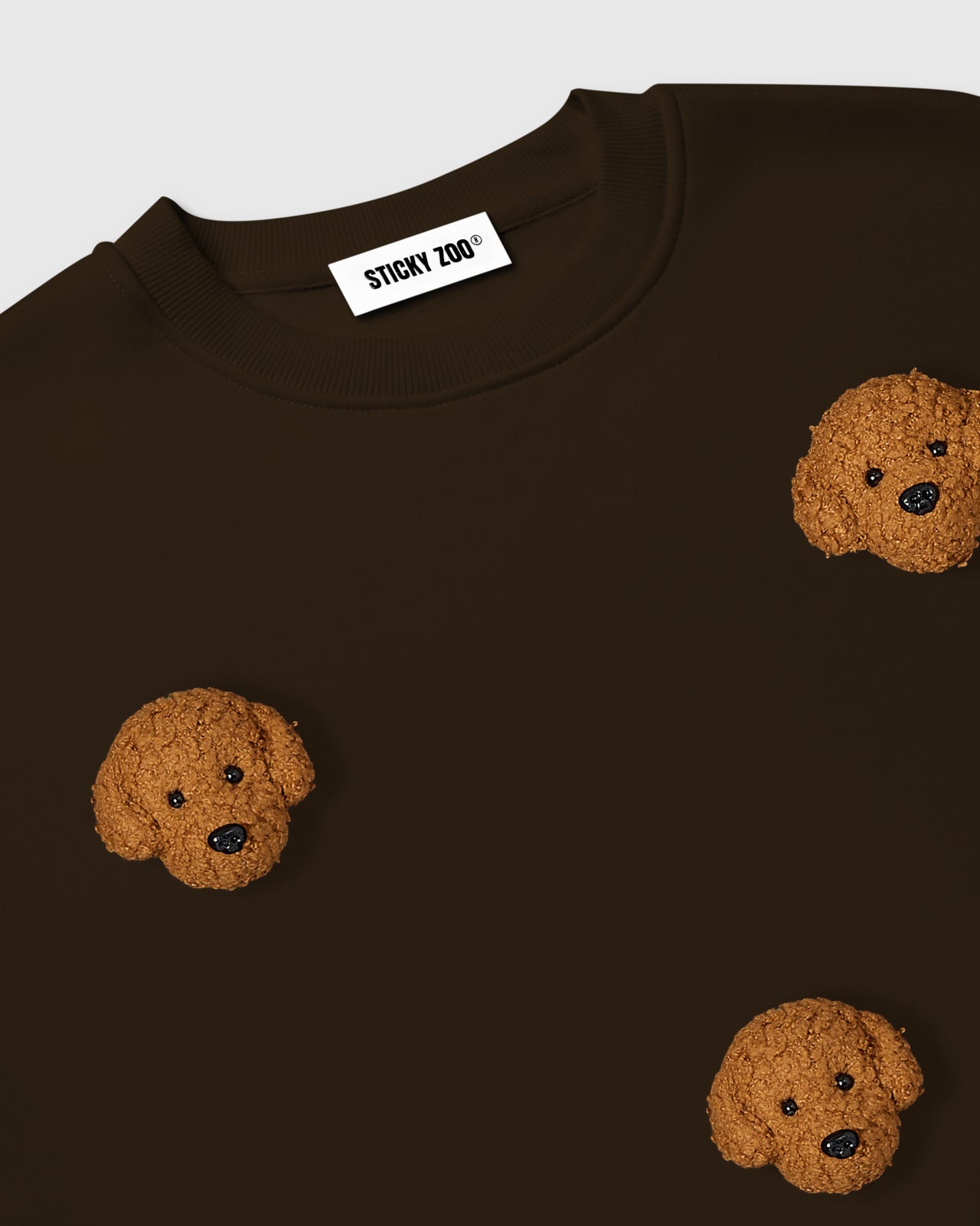 Back view of STICKYZOO Poodle Parade Sweatshirt in dark brown showing oversized boxy silhouette