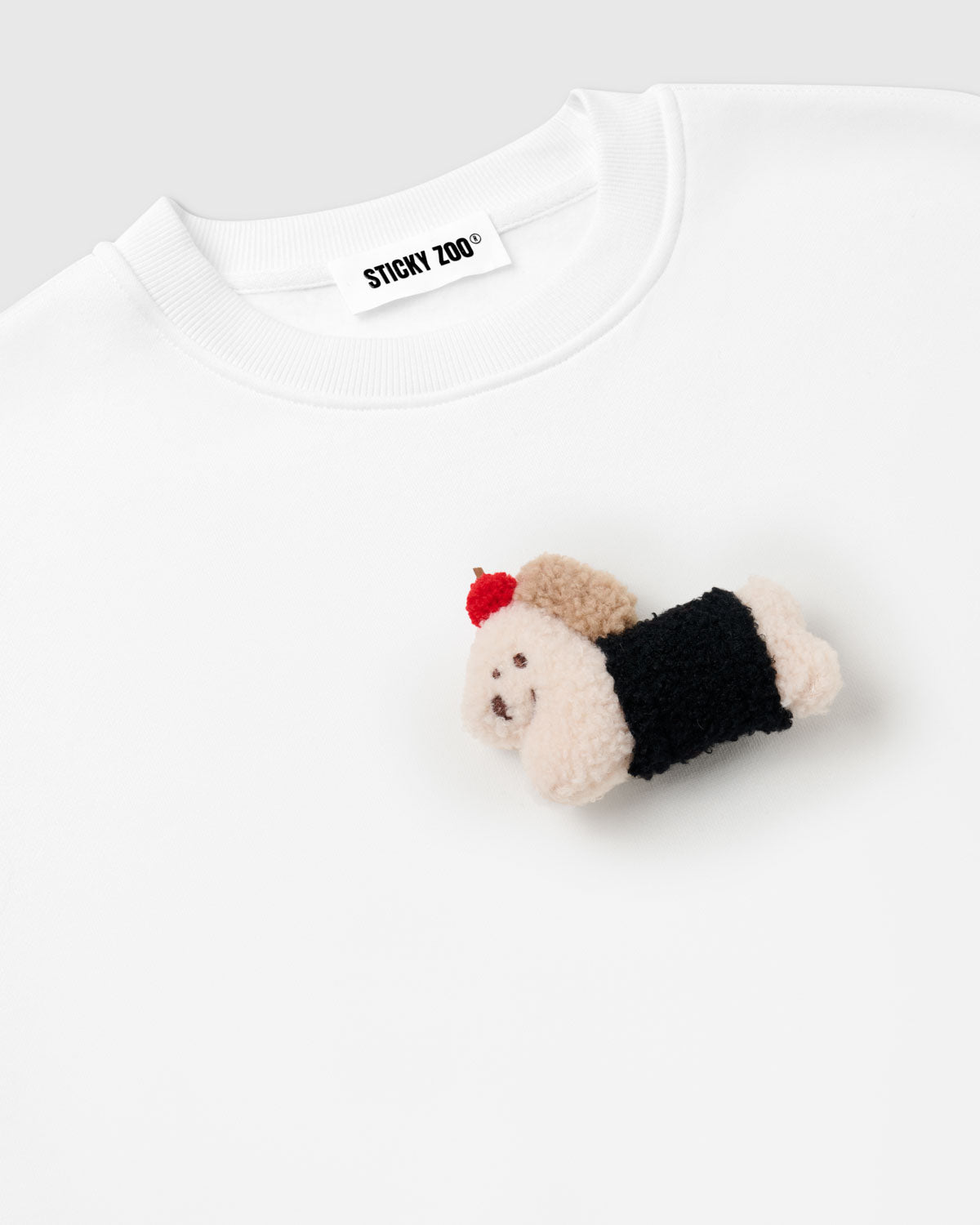Back view of white cotton sweatshirt showing clean seams and oversized boxy proportions