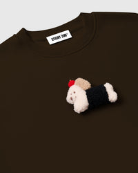 Back view of brown cotton sweatshirt showing clean seams and dropped shoulder construction