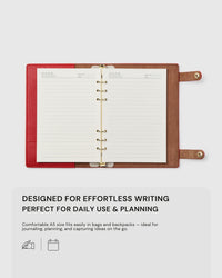 STICKYZOO red A5 notebook open flat showing lined pages, designed for effortless writing, planning, and daily use