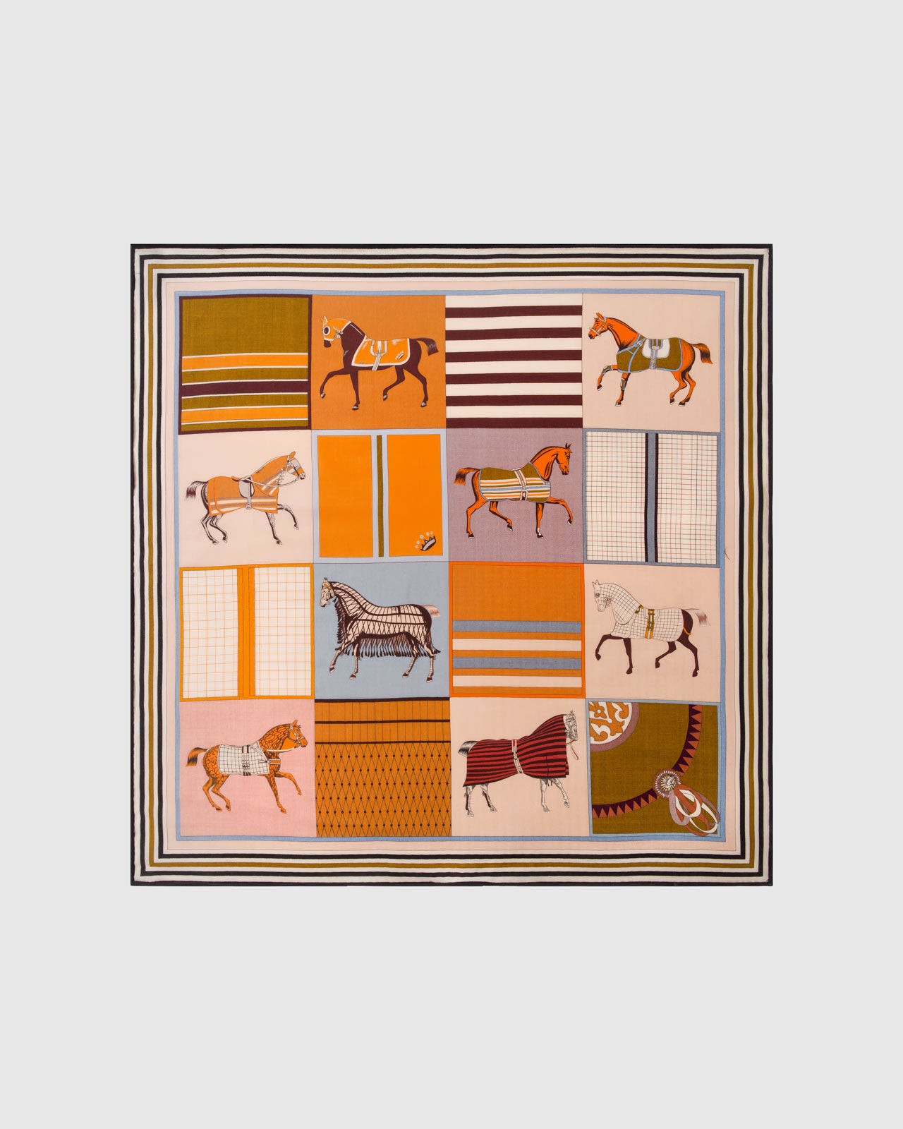 Horse blanket patchwork silk scarf folded into a diamond fold showing the warm patchwork palette by STICKYZOO