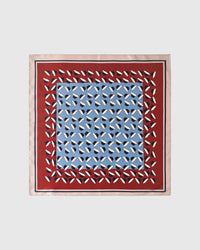 Azure petal silk scarf with geometric navy and ivory print on sky blue and a rust-red border by STICKYZOO