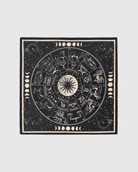 Zodiac wheel silk scarf with hand-illustrated twelve-sign print in ivory on a midnight field by STICKYZOO