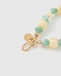 Close-up of gold-plated STICKYZOO clasp with jade and butter beads