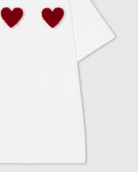 Full-body styling of white Triple Heart T-Shirt showing relaxed boxy proportions