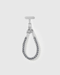 Pewter strap looped short as a wrist strap, showing the grey braided cord and silver-tone hardware