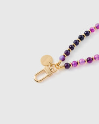 Close-up of gold-plated engraved hook and STICKYZOO charm disc