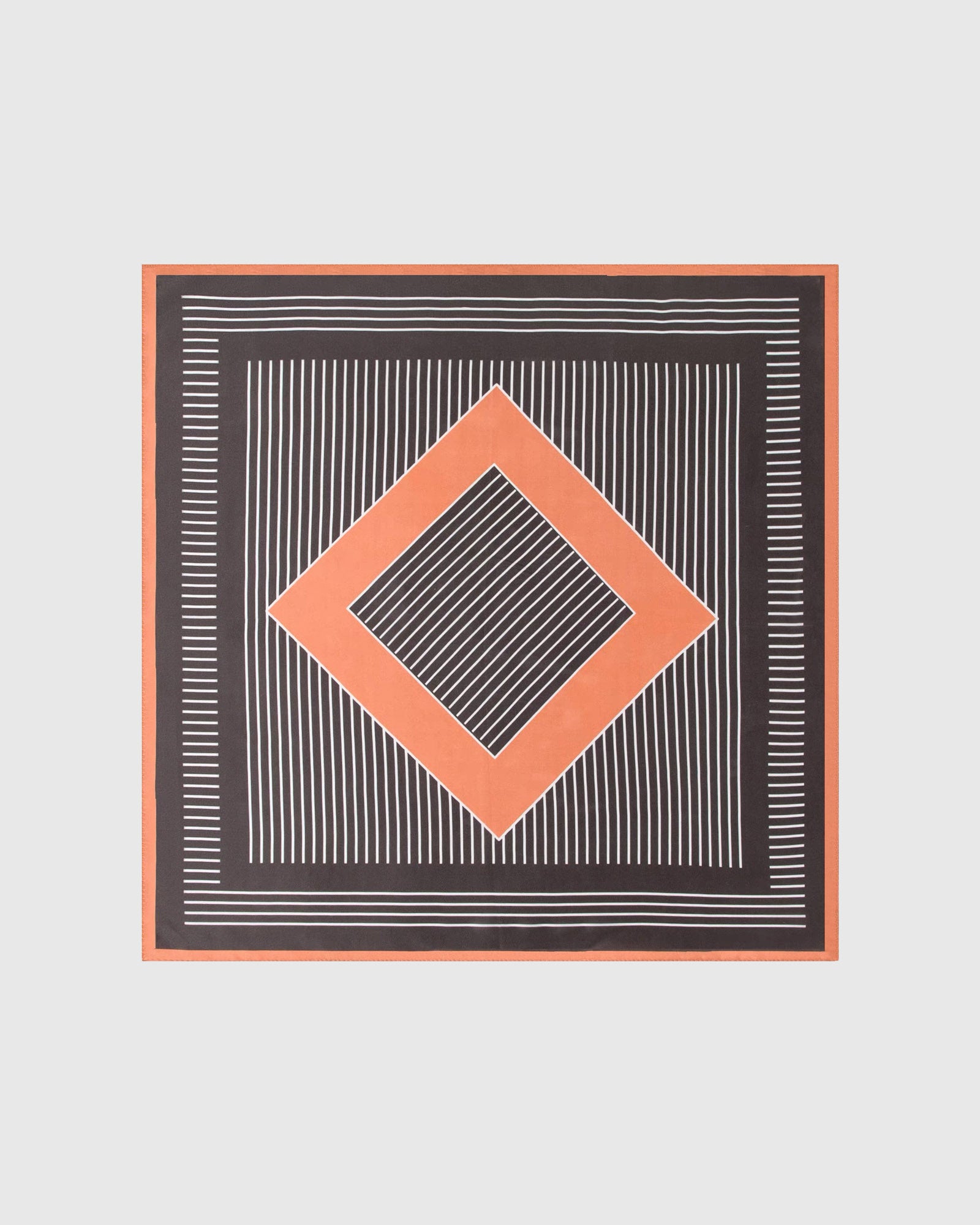 Op-art diamond silk scarf knotted in a bow showing the charcoal field with ivory stripes and terracotta border by STICKYZOO
