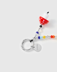 Silver-tone spring ring clasp with engraved STICKYZOO disc and red polka-dot mushroom charm with colorful seed beads