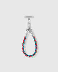 Scarlet strap looped short as a wrist strap, showing the teal and black braided cord and silver-tone hardware