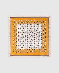 Saffron orchard silk scarf with hand-illustrated ivory and plum petals on a warm orange field by STICKYZOO