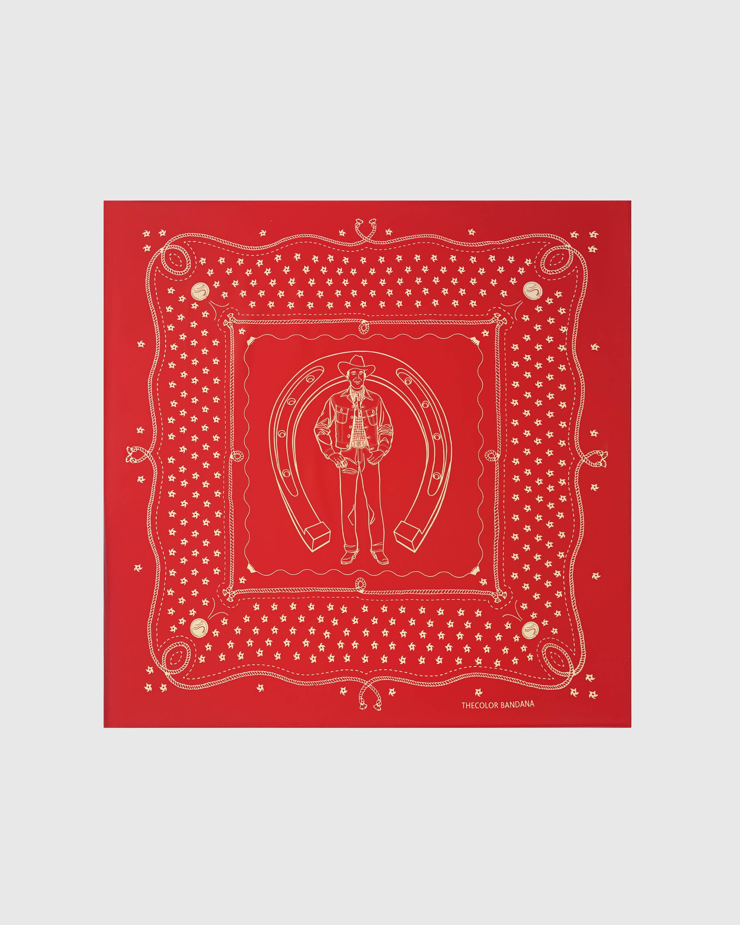 Crimson horseshoe silk scarf with a hand-illustrated cowboy motif and roped border by STICKYZOO