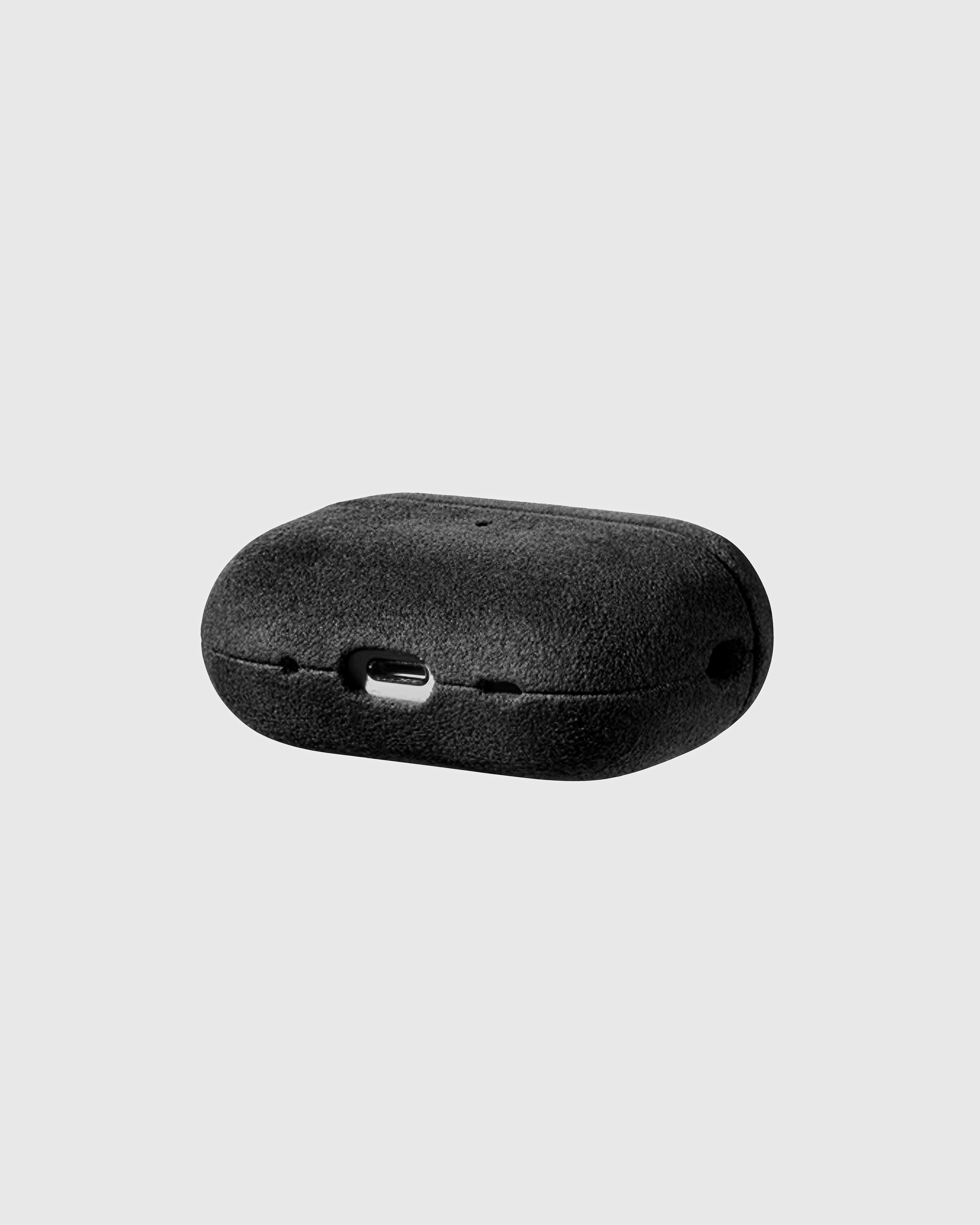 Back view of black Alcantara case showing USB-C port and speaker cutouts