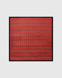 Equestrian stirrup silk scarf with hand-illustrated gold stirrups on red and black border by STICKYZOO