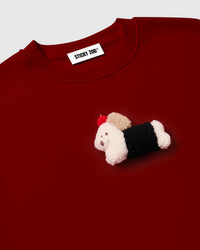 Back view of red cotton sweatshirt showing clean construction and oversized boxy silhouette