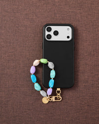 Pastel marble bead phone strap styled flat, handmade bead-by-bead detail