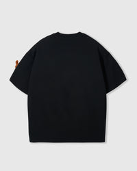 Back view of black Dash Dachshund T-Shirt showing boxy silhouette and ribbed neckline