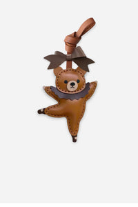 BALLET BEAR CHARM charm handmade from French Alran genuine goatskin — A caramel bear, mid-leap, in a grey tutu. One leg extended. Three days by hand. Arrives in luxury gift packaging. Designed in Amsterdam.